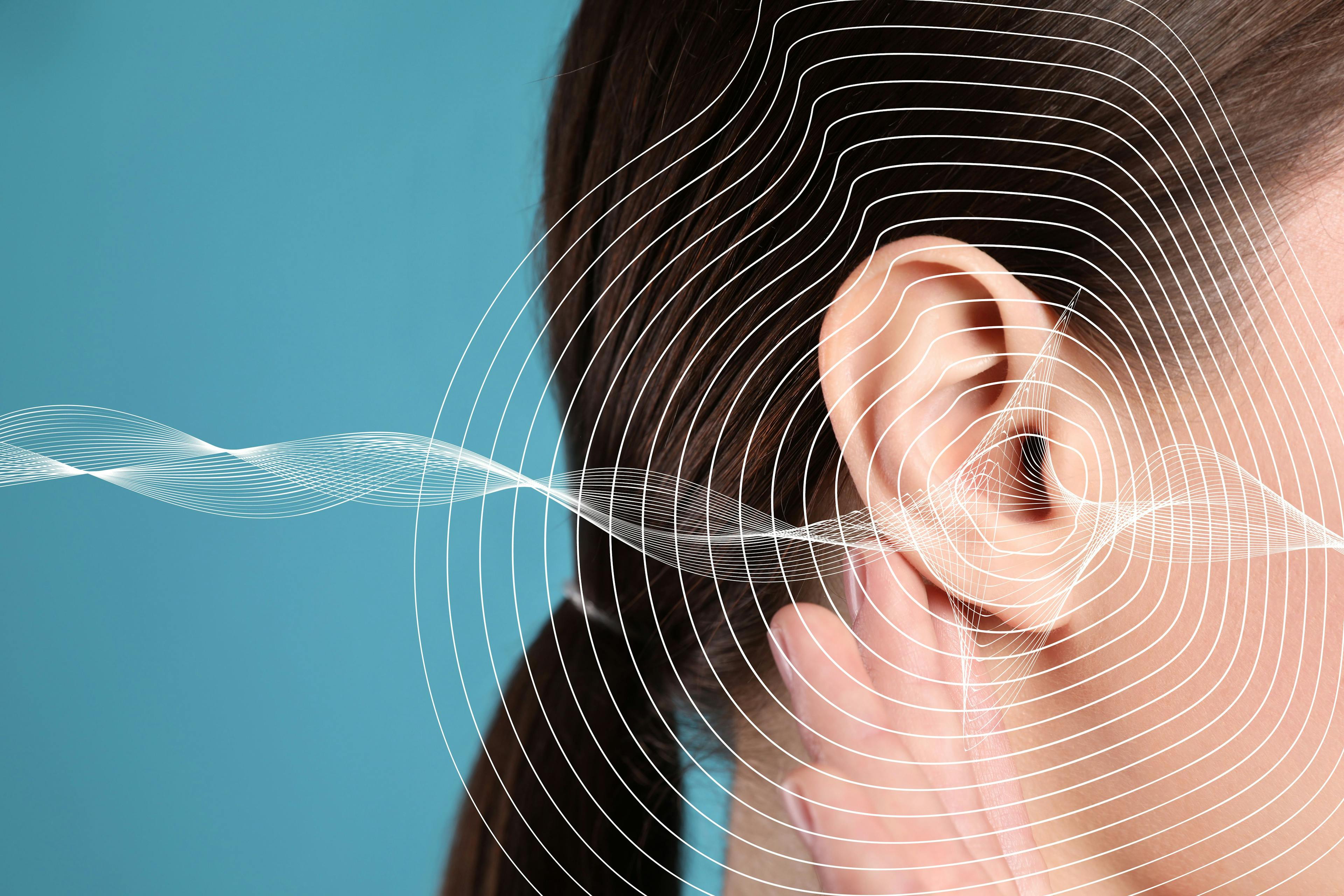 Hearing loss concept. Woman and sound waves illustration on light blue background, closeup: © New Africa - stock.adobe.com