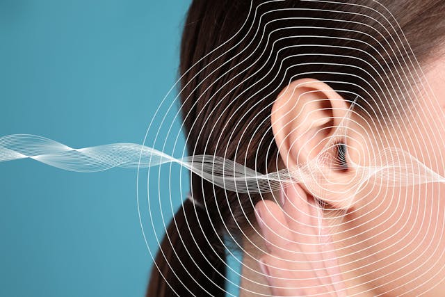 Hearing loss concept. Woman and sound waves illustration on light blue background, closeup: © New Africa - stock.adobe.com